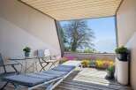 Enjoy breathtaking mountain and lake views from this charming balcony, perfect for relaxation and entertaining.