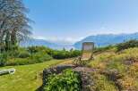 Enjoy breathtaking panoramic views of the lake and mountains from this stunning property.