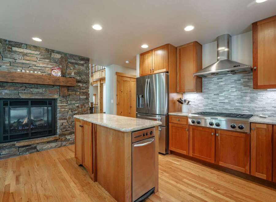 Experience the perfect blend of rustic charm and modern convenience in this stunning kitchen.