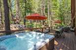 Experience ultimate relaxation in this stunning property featuring a luxurious hot tub perfect for unwinding amidst a serene forest setting.