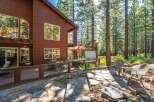 Experience the ultimate mountain retreat with this stunning wooden cabin nestled amongst tall pine trees.