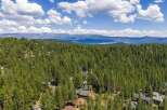 Nestled amidst a dense forest of tall pine trees, this property offers a serene and private mountain retreat.