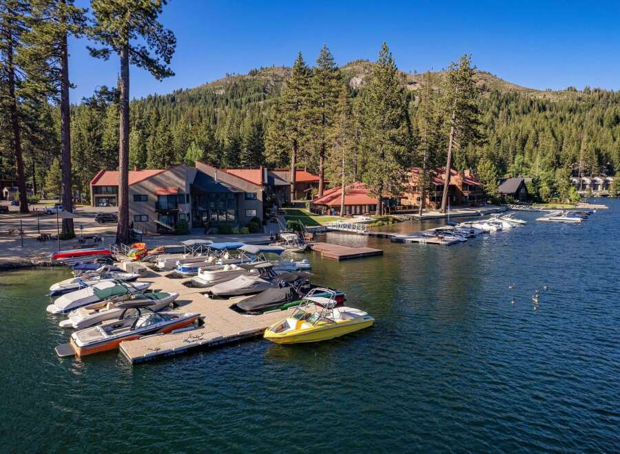 Experience lakeside living with this stunning property featuring a private marina and ample boat dockage.