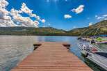 Experience lakeside living with this stunning property featuring a private dock perfect for your boats.