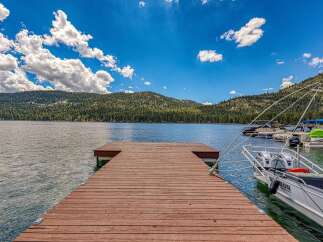 Experience lakeside living with this stunning property featuring a private dock perfect for your boats.