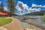 Experience lakeside living at its finest with this stunning property featuring a private dock and boat slips, perfect for water enthusiasts.