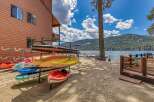 Enjoy lakeside living with this stunning property featuring a private beach and a variety of watercraft ready for adventure.