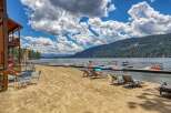 Enjoy lakeside living with this stunning property featuring a private beach and dock.