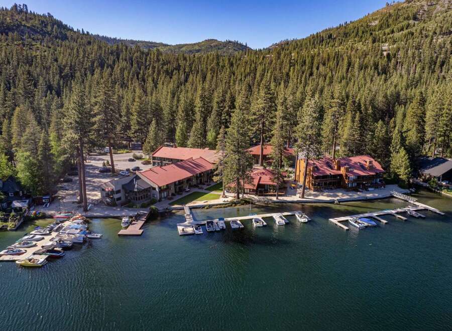Experience lakeside luxury with this stunning property featuring multiple buildings and a private marina.