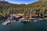 Experience lakeside luxury with this stunning property featuring multiple buildings and a private marina.