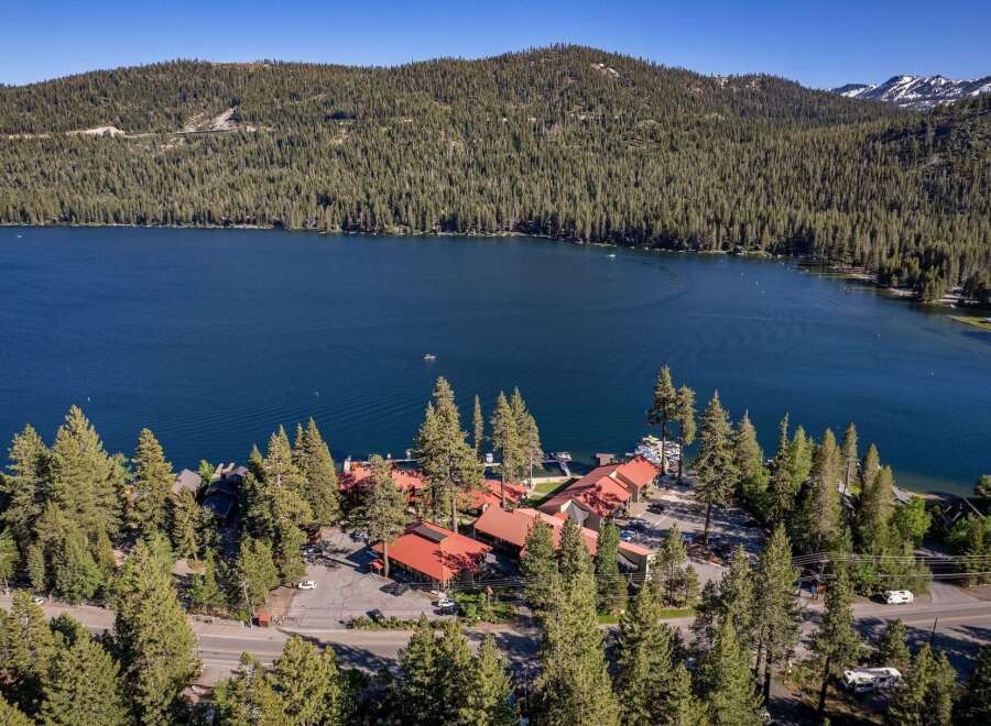 Experience the ultimate lakeside living with this stunning property offering direct access to a pristine blue lake.
