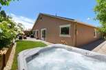 Enjoy ultimate relaxation in this backyard oasis, featuring a bubbling hot tub perfect for unwinding after a long day.