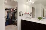 Step into this spacious master suite featuring a large walk-in closet with ample storage for all your clothing and accessories.
