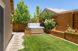 Escape to your private backyard oasis featuring a luxurious hot tub perfect for relaxation.