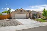 Discover this charming single-story home featuring a spacious three-car garage and a welcoming facade.