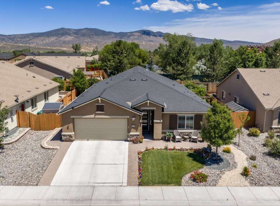 Discover this charming single-story home featuring a welcoming front porch with seating, perfect for enjoying the outdoors.