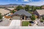 Discover this charming single-story home featuring a welcoming front porch with seating, perfect for enjoying the outdoors.