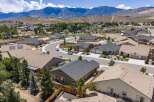 Discover this stunning suburban neighborhood with modern homes nestled against a backdrop of majestic mountains.