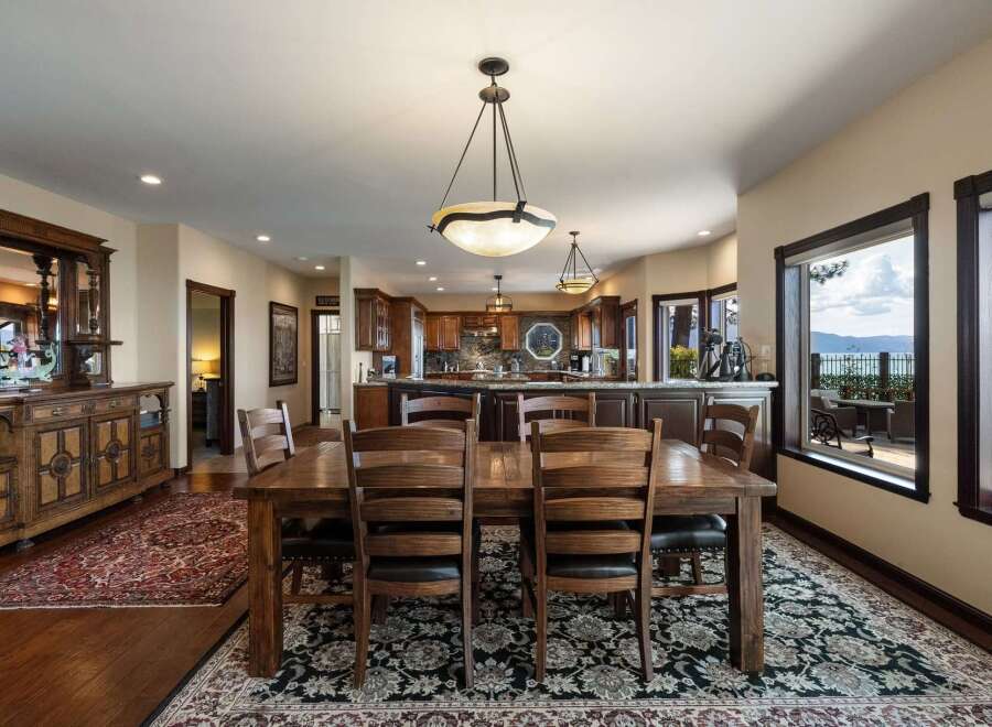 Experience breathtaking lake views from this stunning dining area, perfect for entertaining.