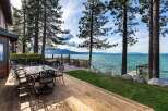 Enjoy breathtaking lake views from this stunning waterfront property, featuring a spacious deck perfect for outdoor entertaining.