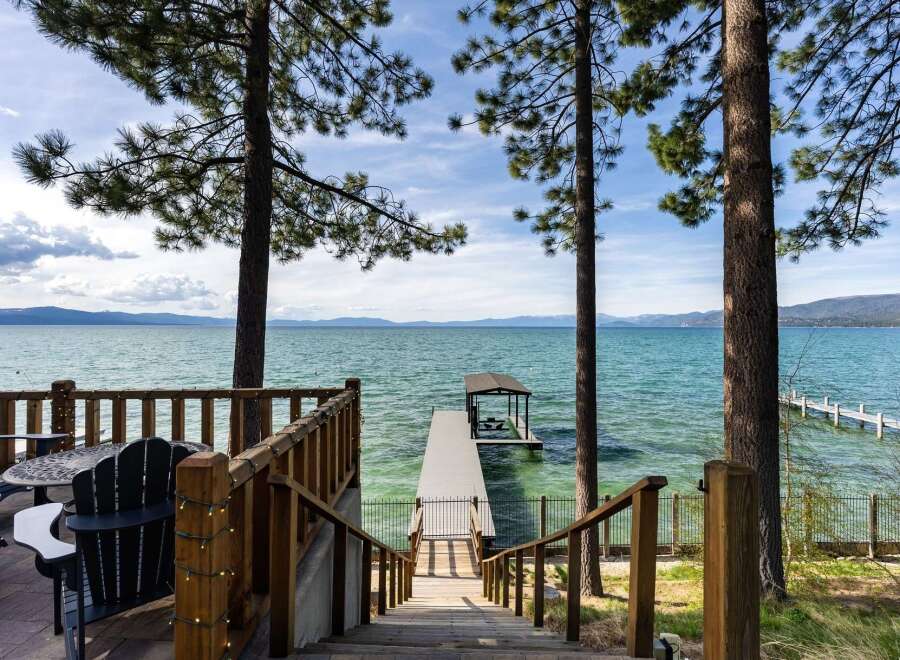 Experience lakeside living with this stunning property featuring a private dock and boat lift, perfect for water enthusiasts.