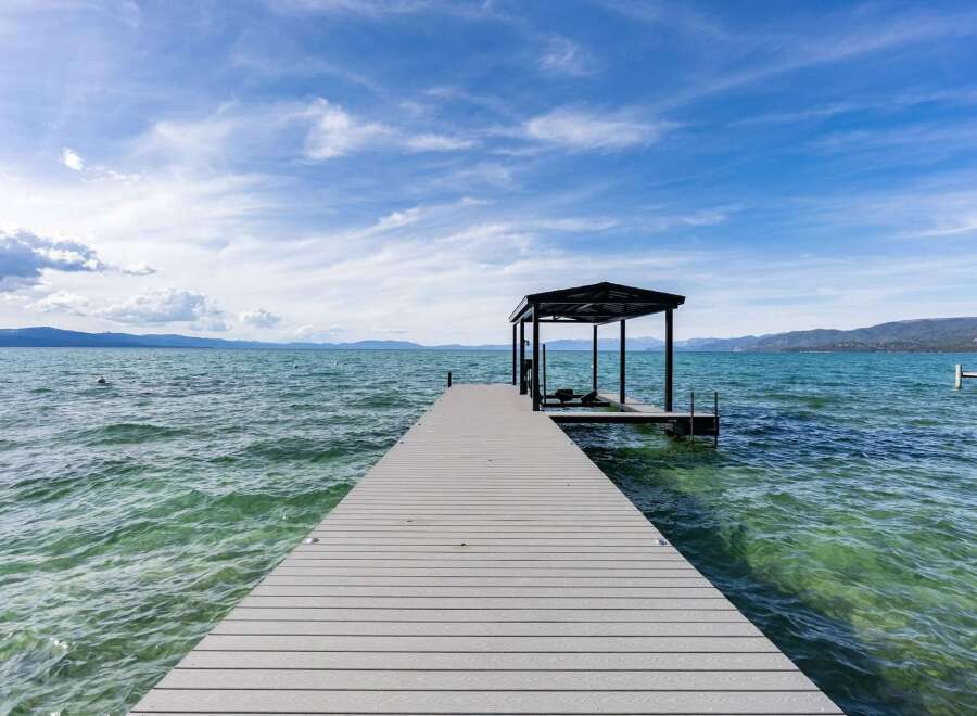 Enjoy direct lake access from this stunning property featuring a private dock with a boat slip.