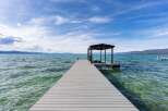 Enjoy direct lake access from this stunning property featuring a private dock with a boat slip.