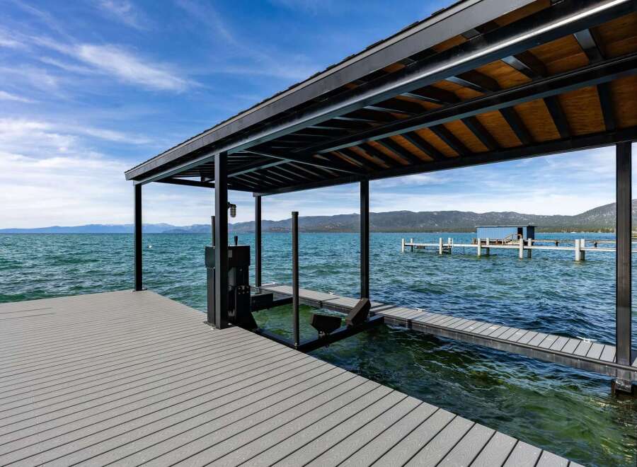 Experience luxury waterfront living with this stunning property featuring a private dock and covered boat slip.