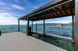 Experience luxury waterfront living with this stunning property featuring a private dock and covered boat slip.