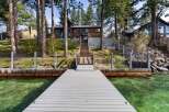 Experience luxury lakeside living with this stunning property featuring a private dock and breathtaking water views.