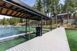Experience luxury lakeside living with this stunning property featuring a private dock and boat lift, perfect for enjoying all your favorite water activities.