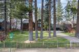 Nestled among mature pine trees, this stunning property offers a serene retreat with a beautiful lake view.