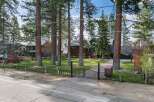 Discover this stunning property featuring a grand entrance with a paved driveway leading to a beautiful home.