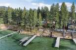 Experience luxury lakeside living with this stunning property featuring multiple private docks and boat lifts, perfect for water enthusiasts.