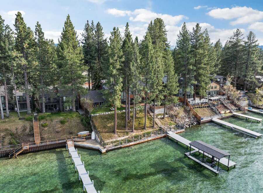 Experience luxury lakeside living with this stunning property featuring multiple private docks and boat lifts, perfect for water enthusiasts.