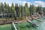 Experience luxury lakeside living with this stunning property featuring multiple private docks and boat lifts, perfect for water enthusiasts.