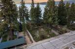 Experience luxury lakeside living in this stunning property, nestled among towering pine trees with breathtaking views of the water and mountains.