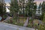 Experience luxury living in this stunning lakefront property, nestled amidst towering pine trees.