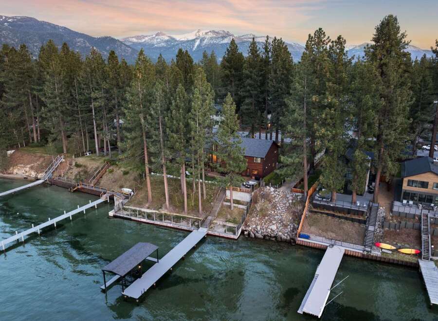 Experience luxury lakeside living with this stunning property featuring multiple private docks and boat lifts, perfect for water enthusiasts.