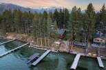 Experience luxury lakeside living with this stunning property featuring multiple private docks and boat lifts, perfect for water enthusiasts.