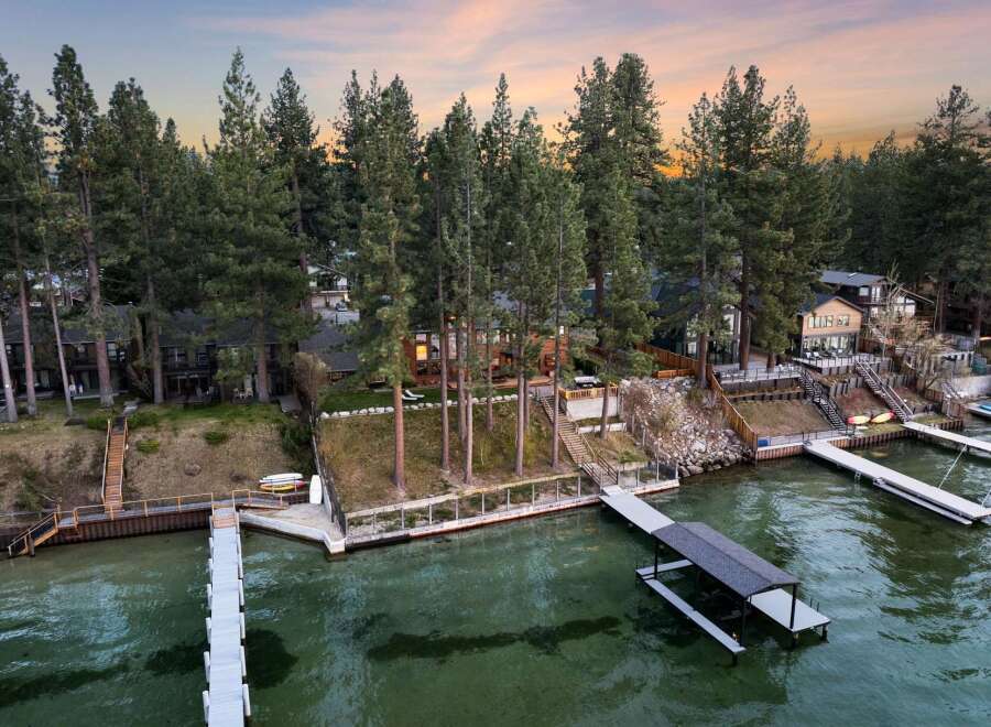 Experience luxury lakeside living with this stunning property featuring multiple private docks and boat lifts, perfect for water enthusiasts.