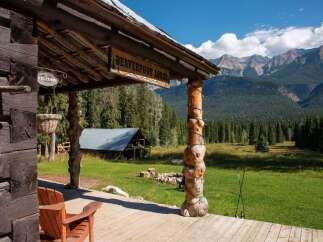 Experience the rustic charm of Beaverfoot Lodge, nestled amidst breathtaking mountain scenery.