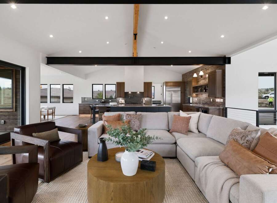 Experience modern living in this spacious open-concept home, featuring a gourmet kitchen with a large island and sleek cabinetry.