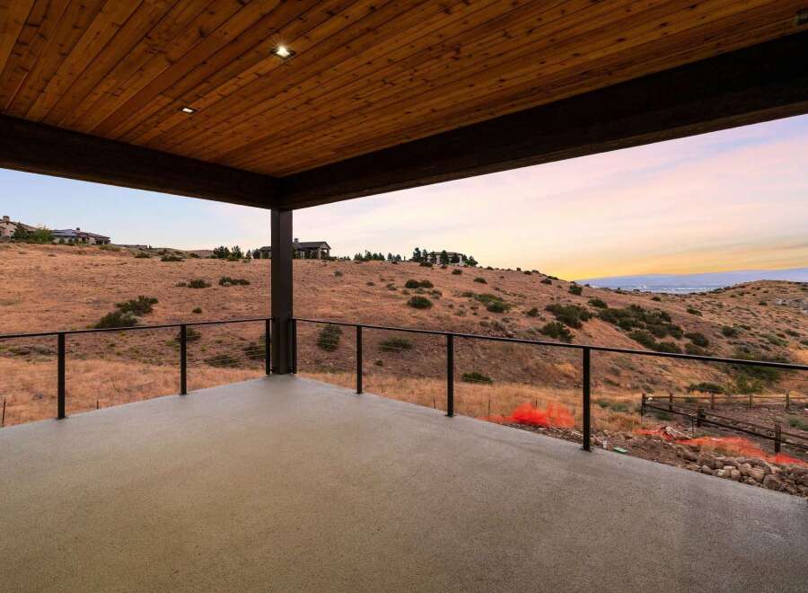 Enjoy breathtaking sunset views from this expansive covered patio, perfect for outdoor entertaining.