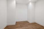 Discover this versatile empty room, perfect for a home office, storage, or creative studio.