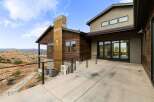 Experience modern living with this stunning home featuring expansive glass doors that open to breathtaking mountain views.