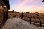 Experience breathtaking sunset views from this expansive concrete patio, perfect for outdoor entertaining.