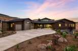 Experience modern luxury in this stunning contemporary home, featuring a striking wood and stucco exterior that blends seamlessly with the natural landscape.