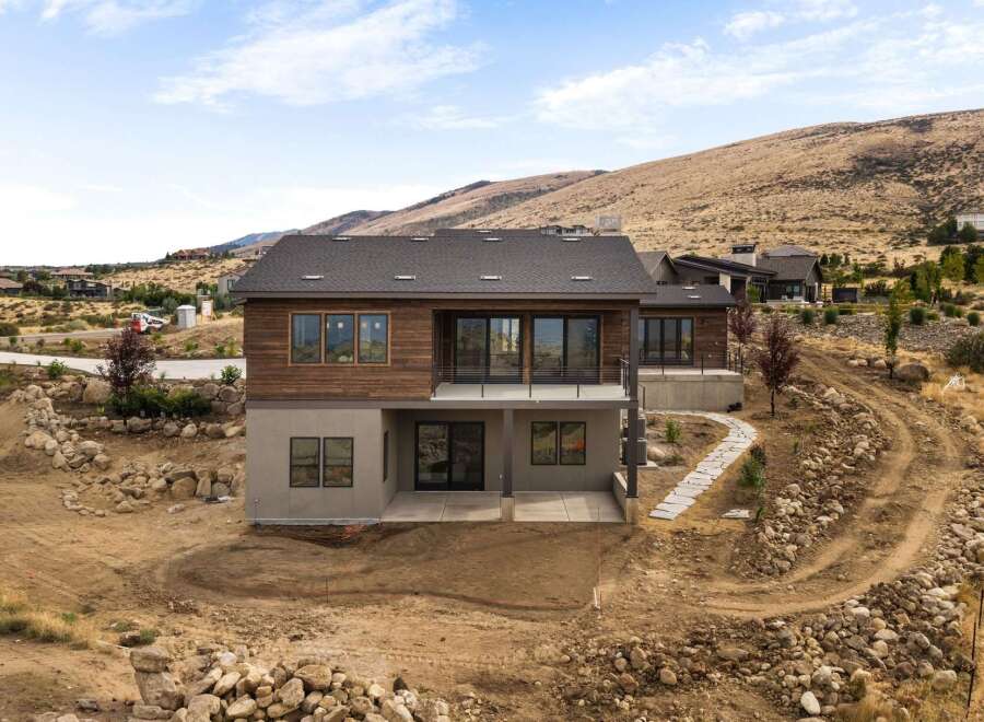 Discover modern living in this stunning new construction home, nestled on a hillside with breathtaking views.