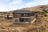 Discover modern living in this stunning new construction home, nestled on a hillside with breathtaking views.